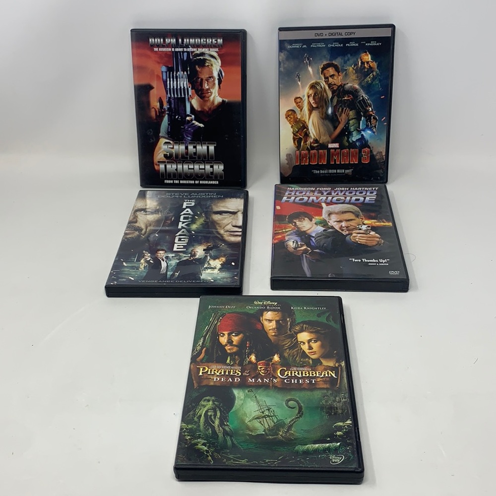 5 DVD movies 🎥 used, iron man, pirates of the Caribbean, the package & more